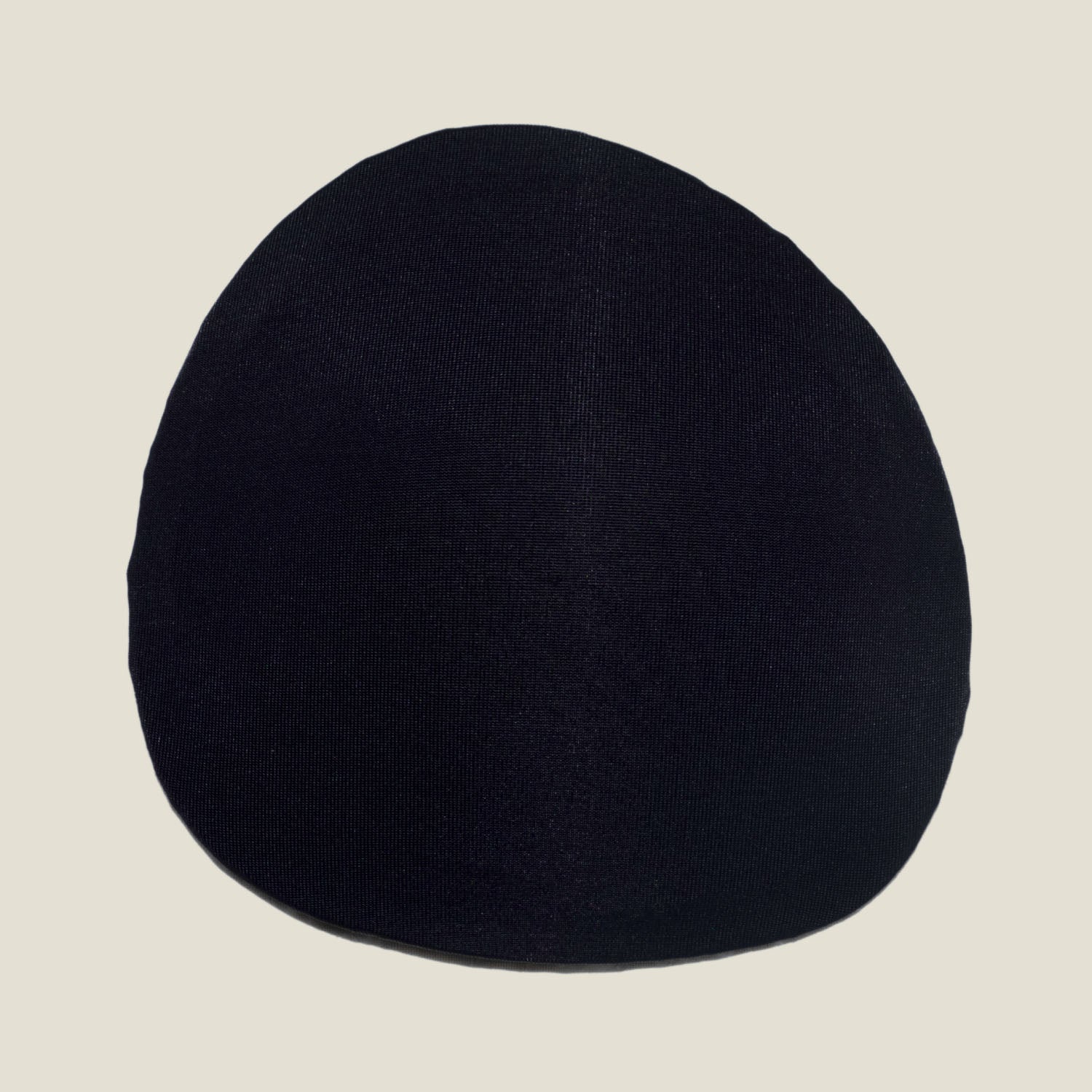 Outer surface of WUKA Maternity Contoured Nursing Pad made from soft breathable fabric for discreet nursing wear.