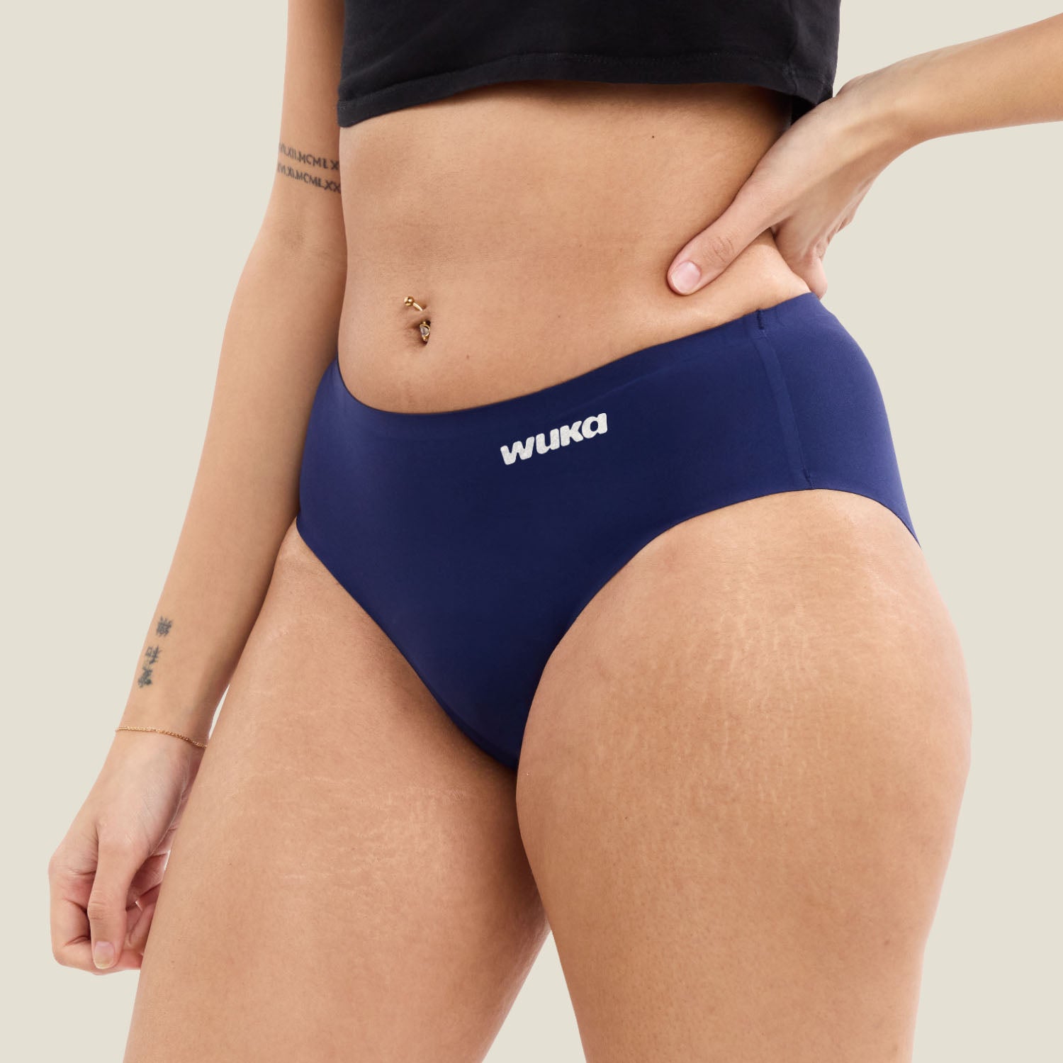 Side view of WUKA navy seamless period underwear for teens, made for super heavy flow with no VPL and ultra-soft fabric.