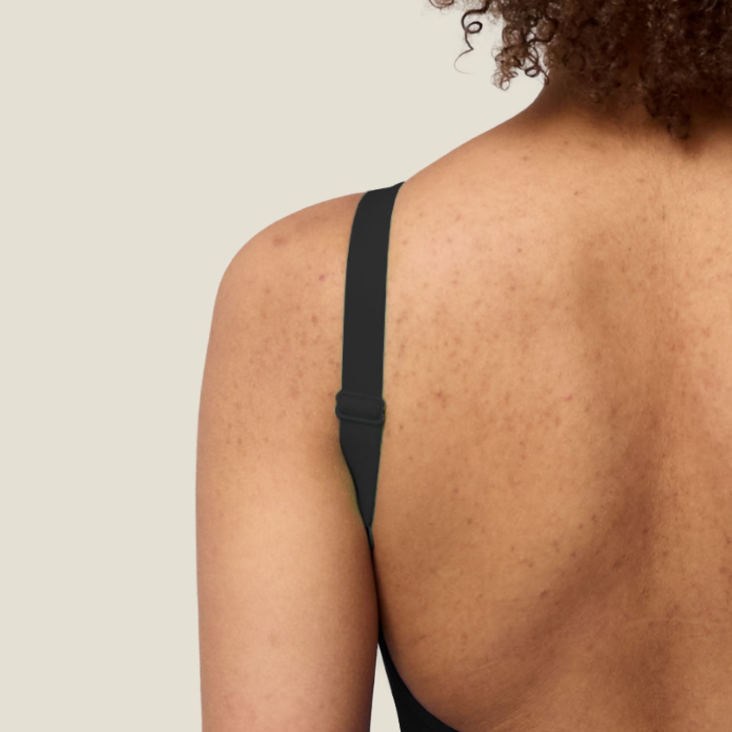 Detail of adjustable strap on WUKA Scoopback Period Swimsuit — custom fit for body confidence in the water.