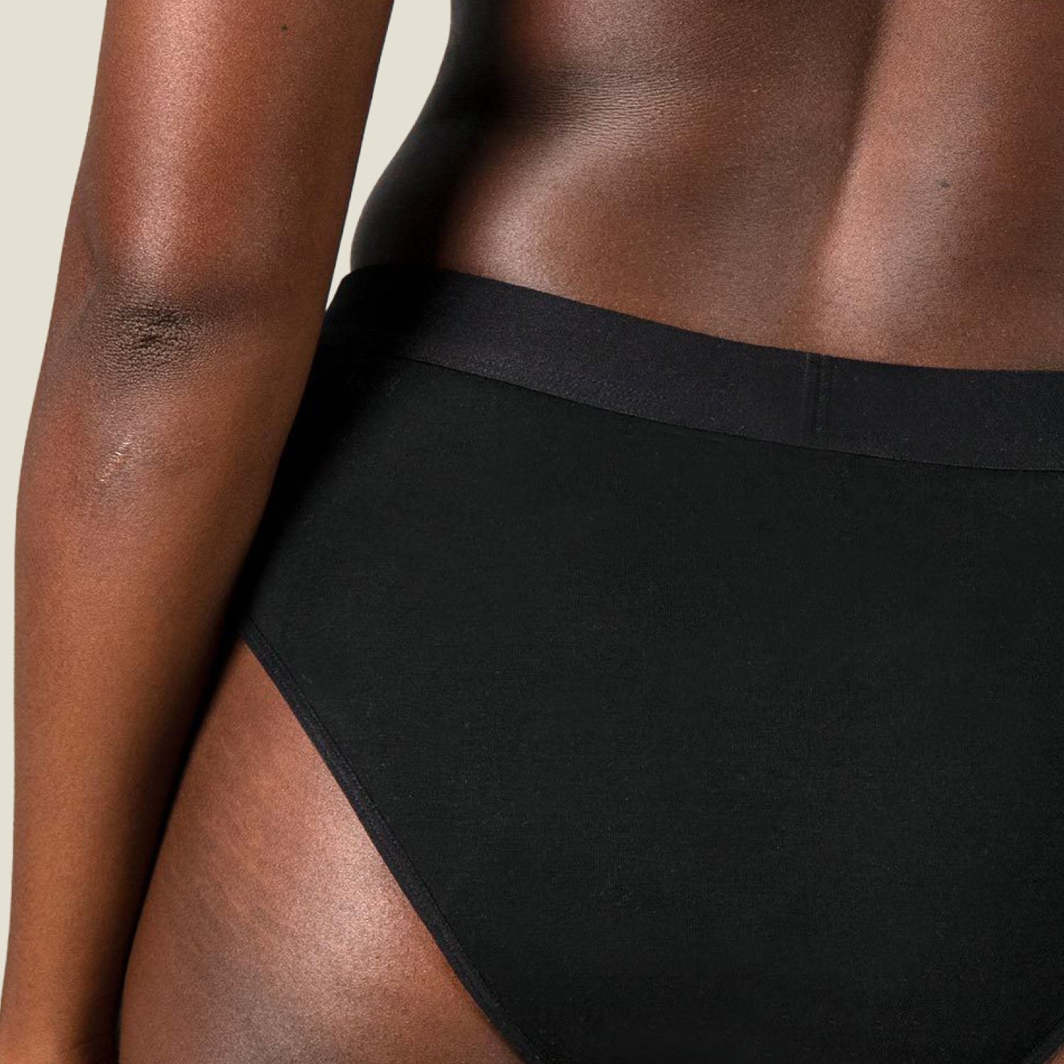 Detail shot of the WUKA Ultimate™ Bikini Period Pants for medium flow, showing fabric texture and stitching on the waistband.