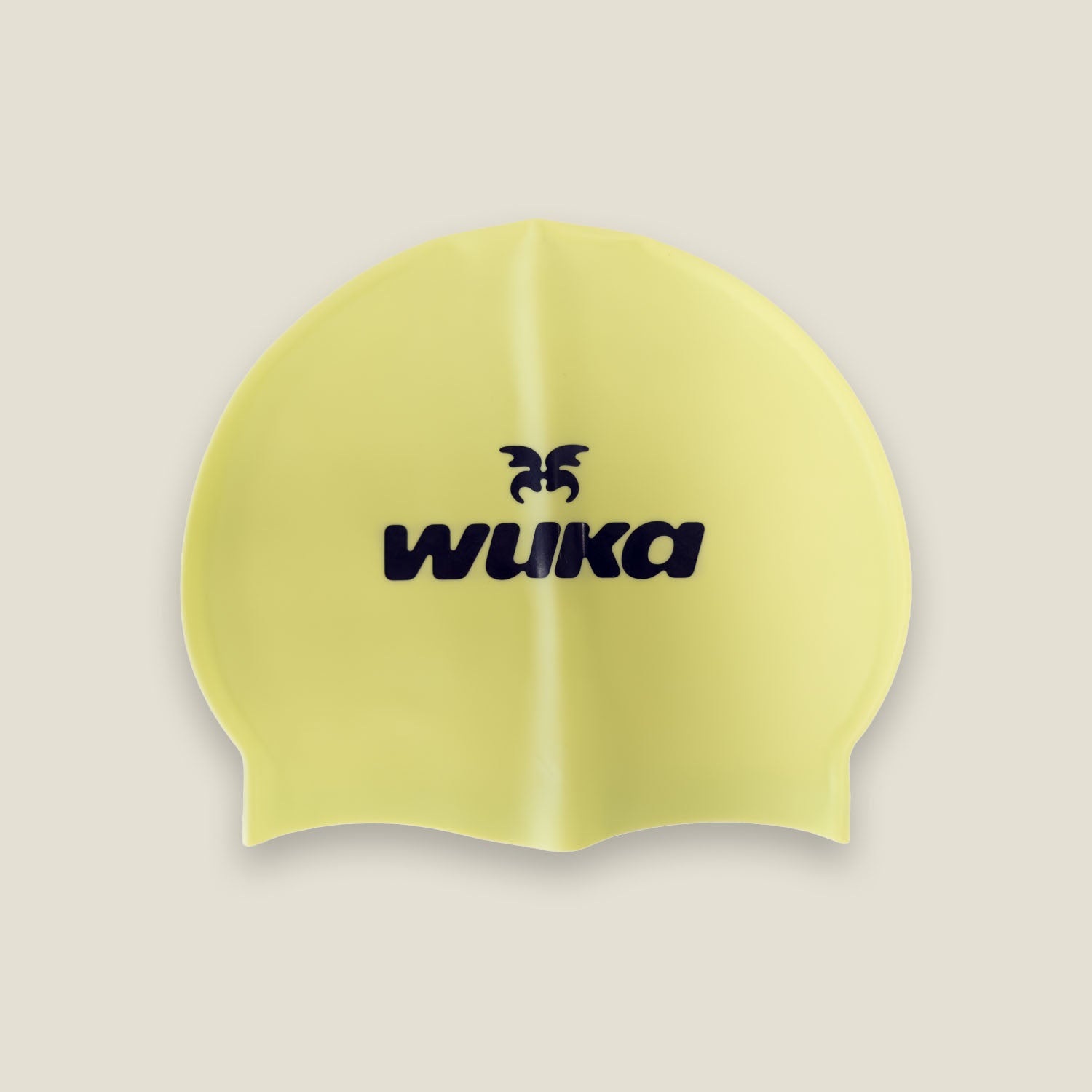 Yellow silicone swim cap with WUKA logo for teen swimmers and swimming lessons