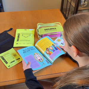 WUKA Teen Period Starter Kit for first periods, featuring the pink edition of "The Girls' Guide to Growing Up Great" educational book alongside leak-proof underwear, intimate wipes, and heat patches for stress-free cycle care